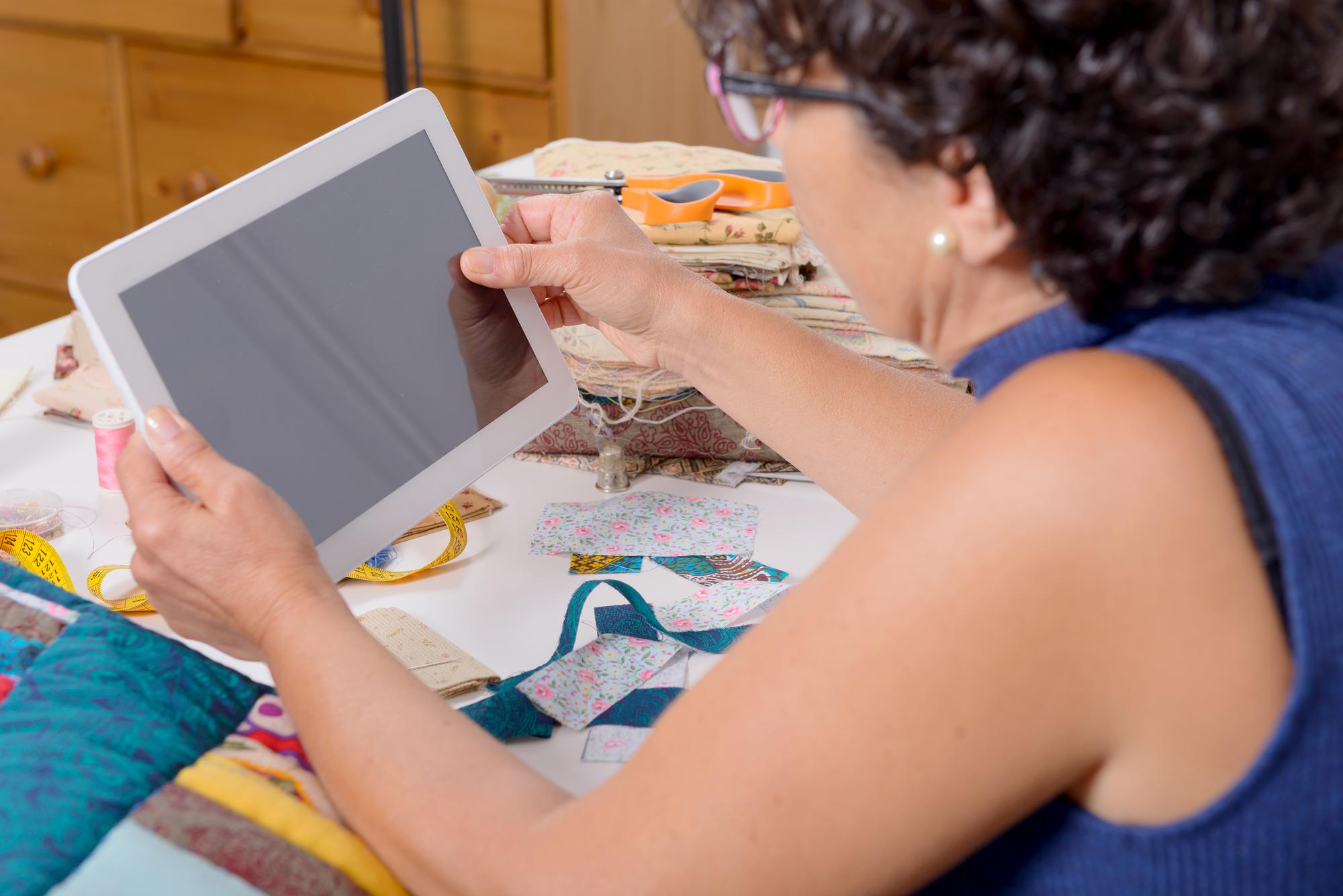 Instructor demonstrating hand embroidery with LED guide