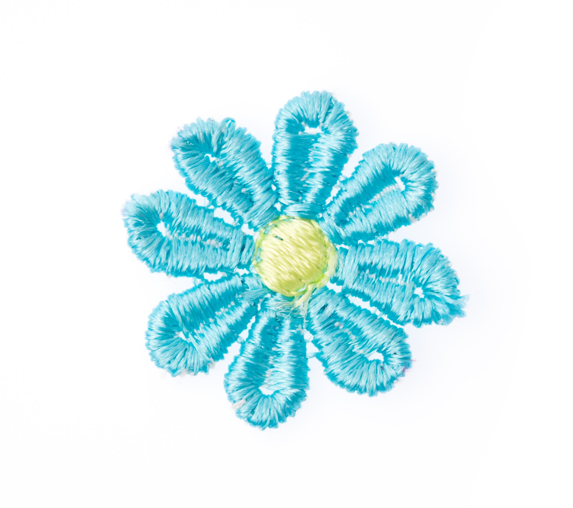 Close-up embroidered floral patch with metallic threads